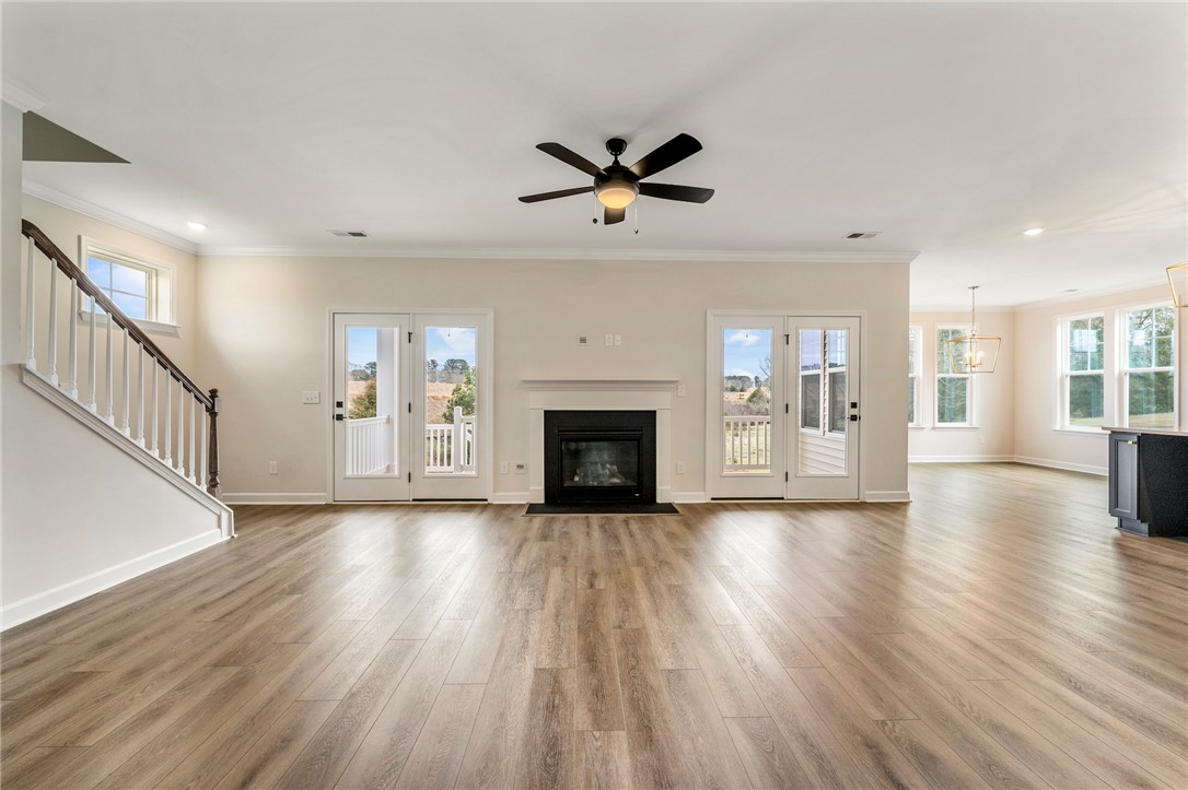 3140 Midway Road Anderson, SC 29621 - Photo 6 of 39 This expansive living area offers seamless indoor-outdoor living, with a fireplace and modern flooring.