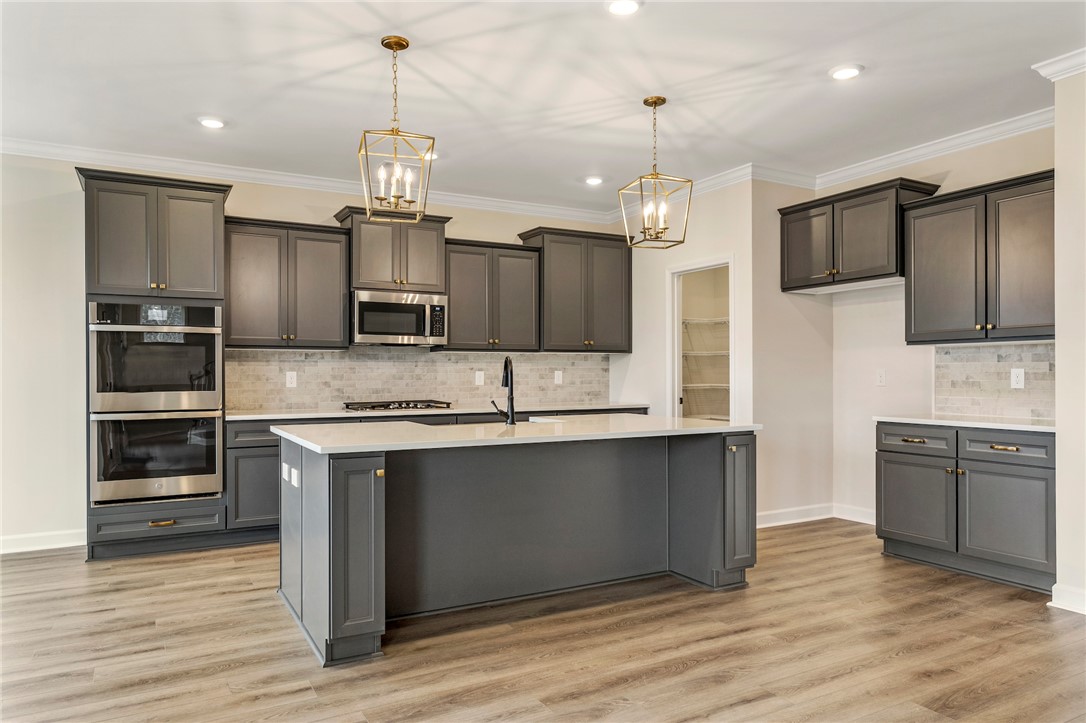 3140 Midway Road Anderson, SC 29621 - Photo 10 of 39 This kitchen showcases a functional layout and ample storage for seamless culinary endeavors.