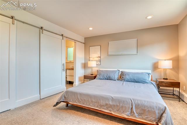 2738 Rigel Drive Colorado Springs, CO 80906 - Photo 25 of 50 primary bedroom: small office & bathroom adjoin