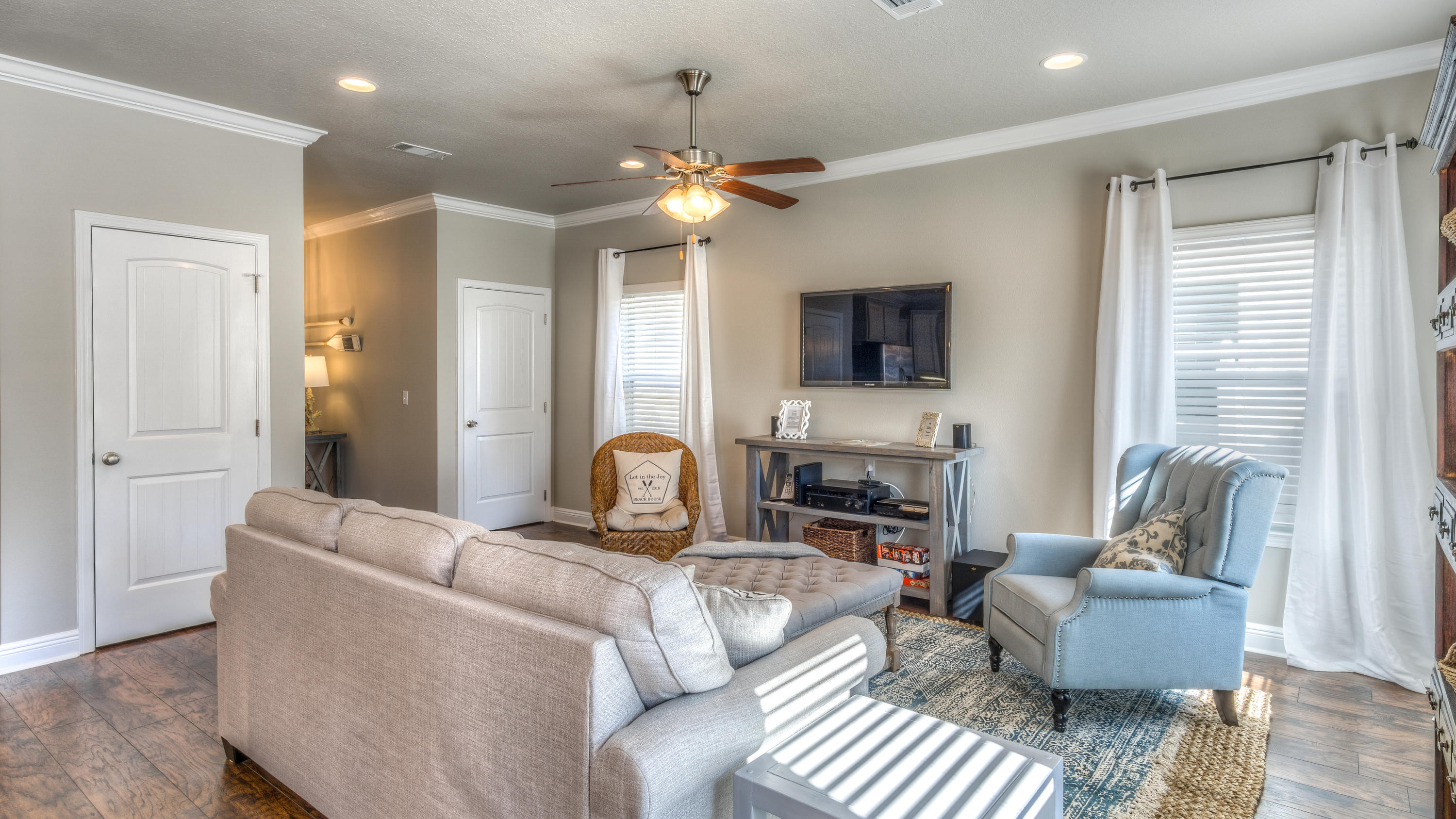 49 Topside Drive Inlet Beach, FL 32461 - Photo 11 of 46 a living room with furniture a flat screen tv and a window