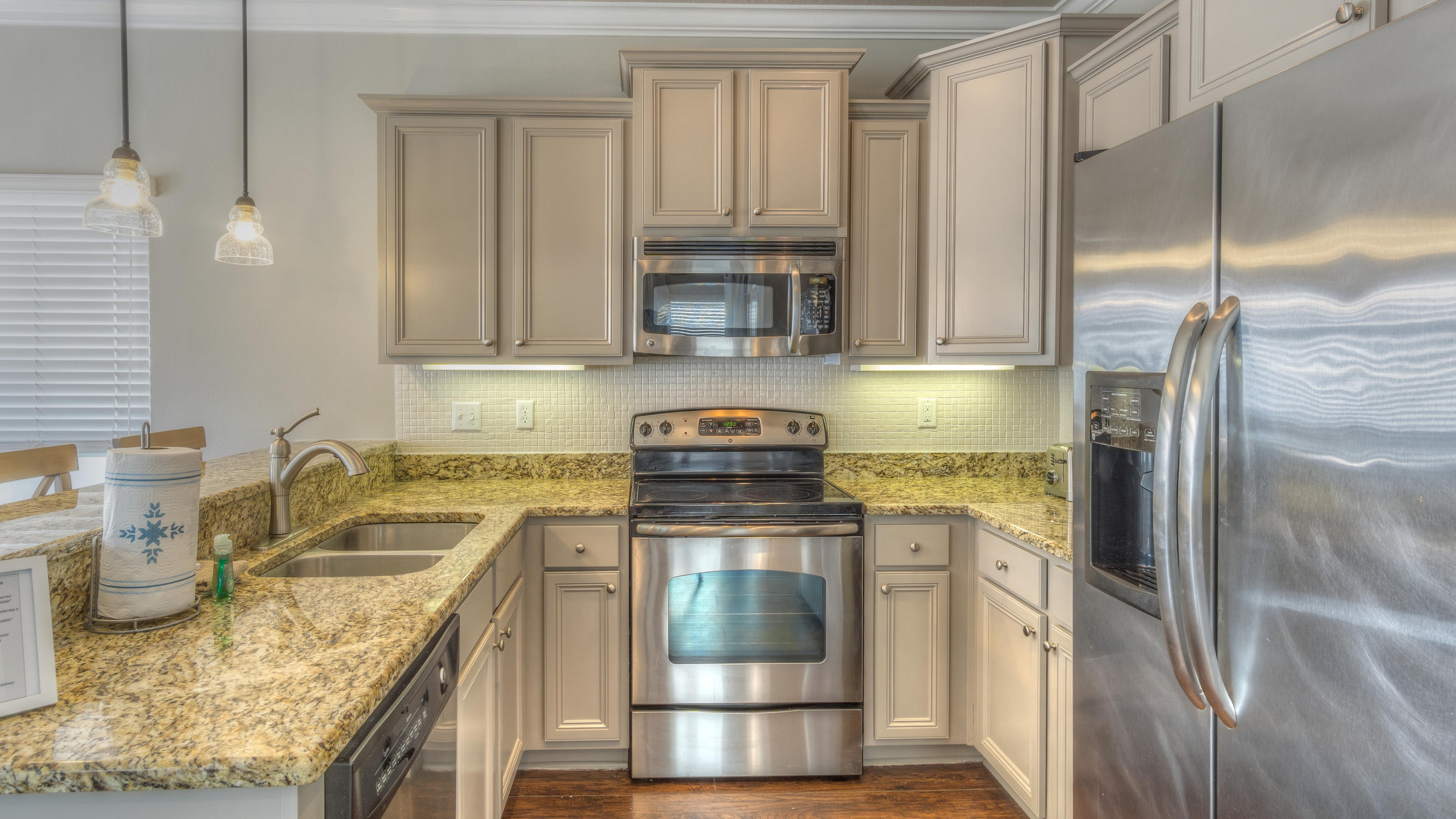 49 Topside Drive Inlet Beach, FL 32461 - Photo 14 of 46 a kitchen with a stove top oven a sink and a refrigerator
