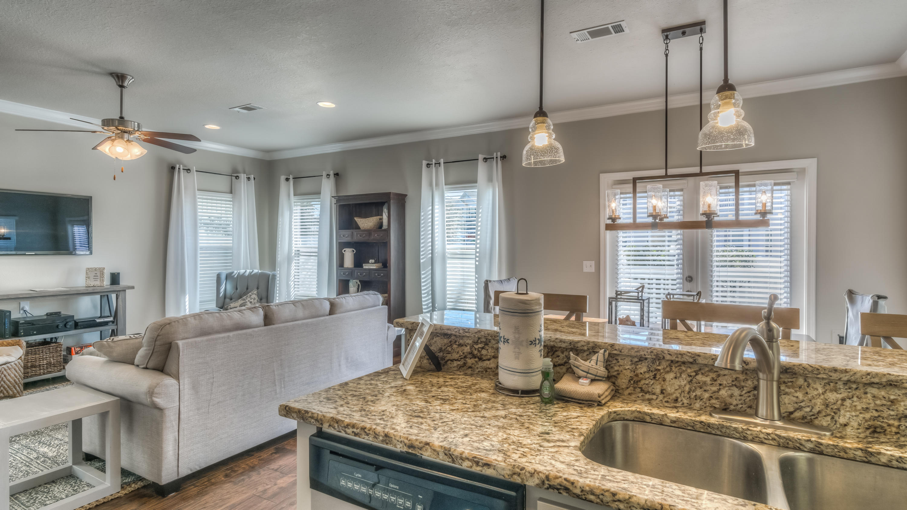49 Topside Drive Inlet Beach, FL 32461 - Photo 15 of 46 a kitchen with granite countertop a sink a counter top space and living room view