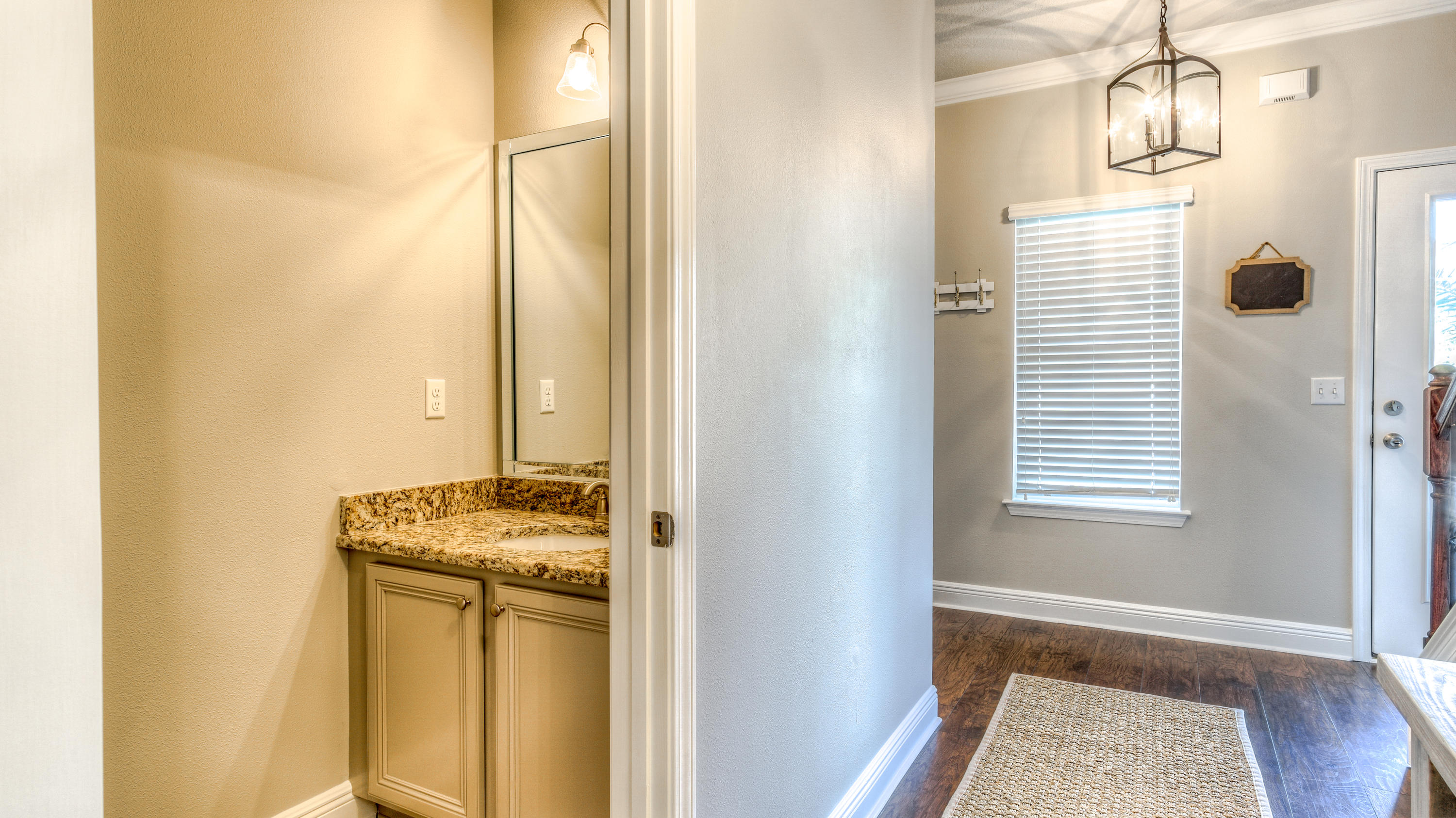 49 Topside Drive Inlet Beach, FL 32461 - Photo 8 of 46 a bathroom with a granite countertop sink a vanity and a mirror