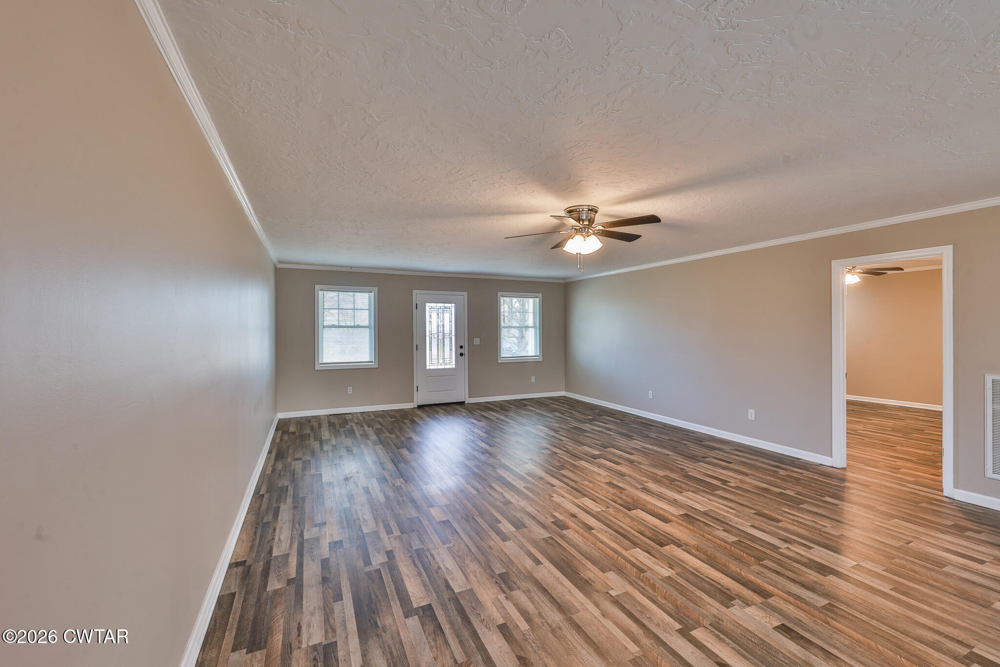 2479 Billingsby Road Martin, TN 38237 - Photo 12 of 29 a view of an empty room with wooden floor and a window