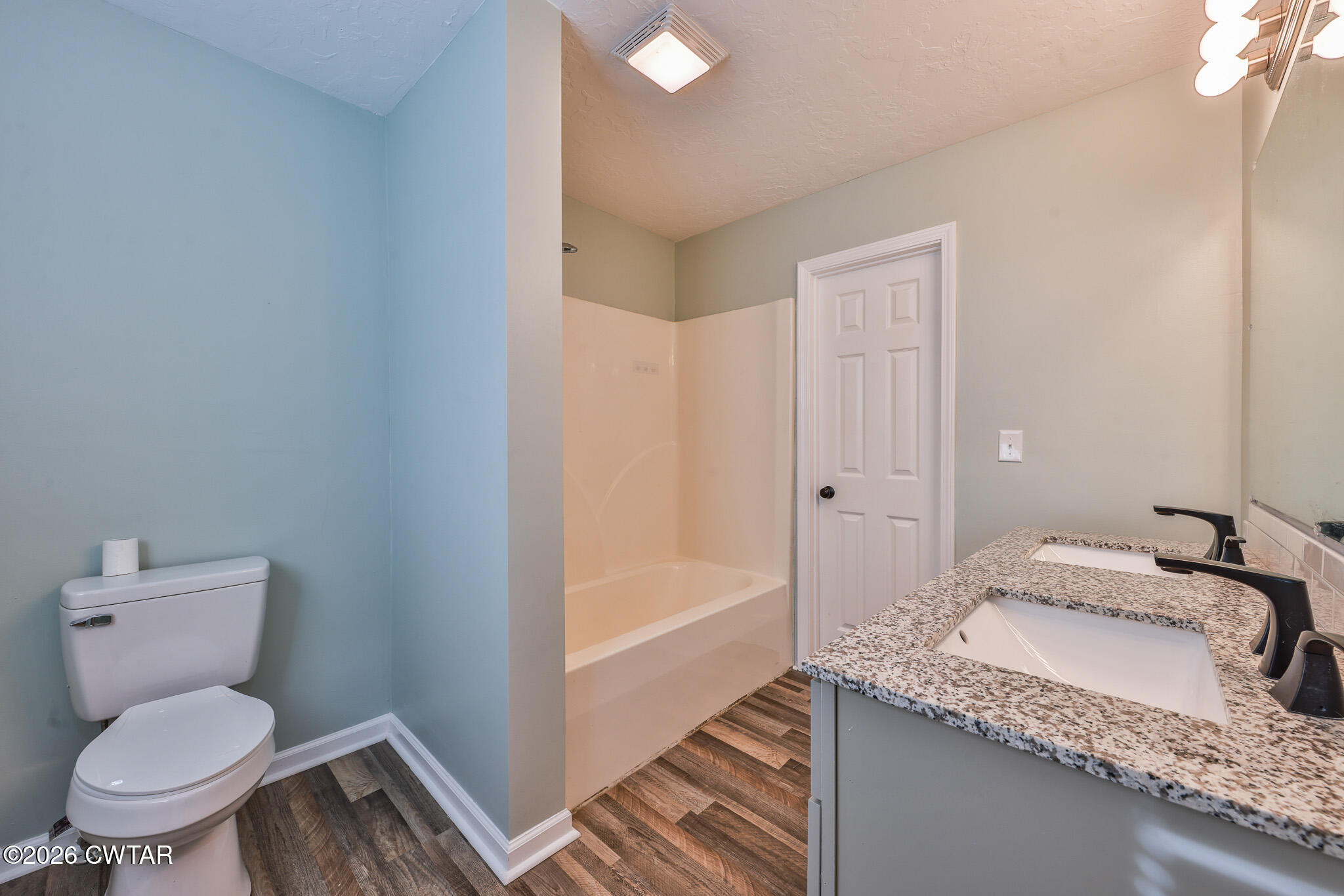2479 Billingsby Road Martin, TN 38237 - Photo 15 of 29 a bathroom with a granite countertop sink and a mirror