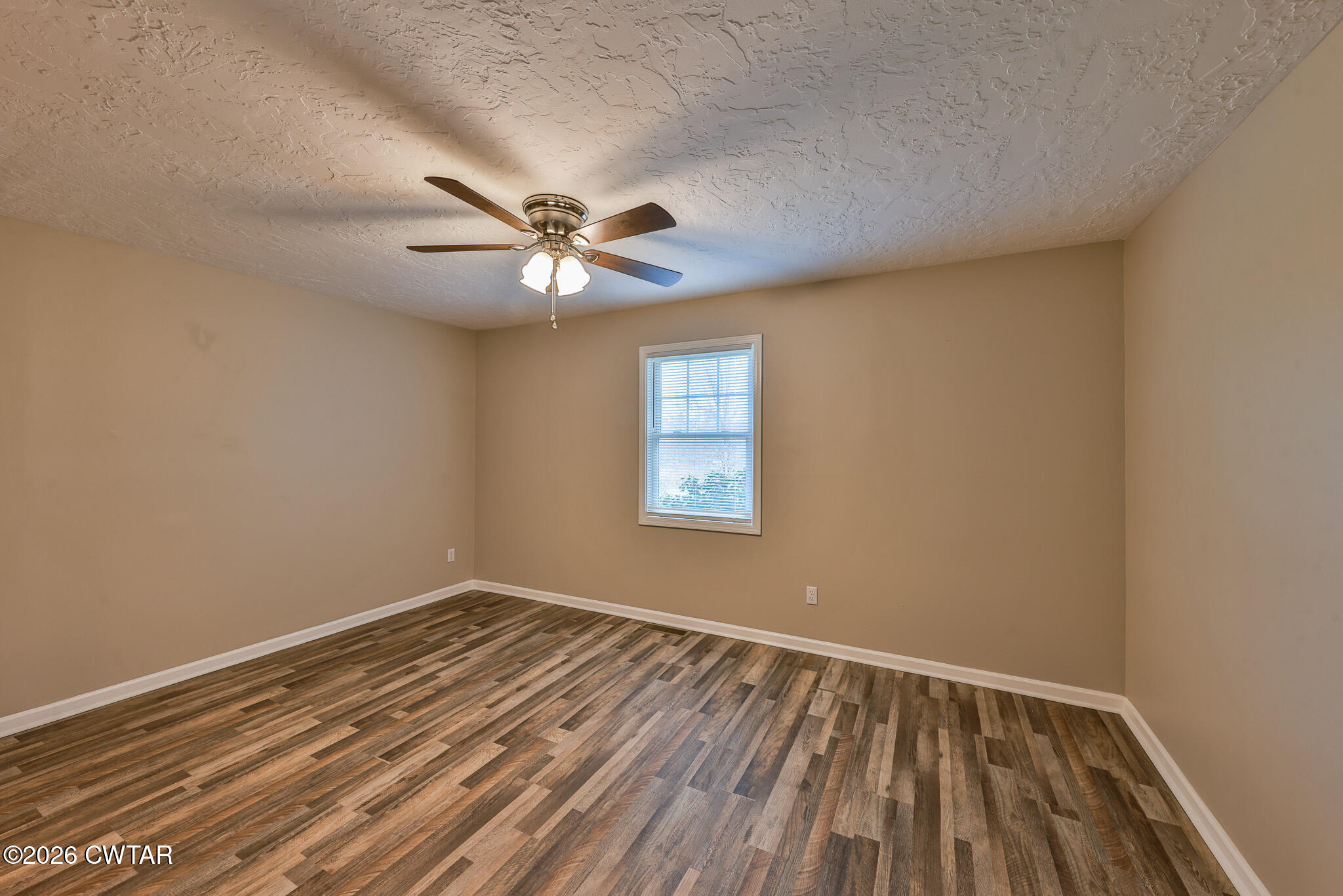 2479 Billingsby Road Martin, TN 38237 - Photo 18 of 29 wooden floor in an empty room with a window