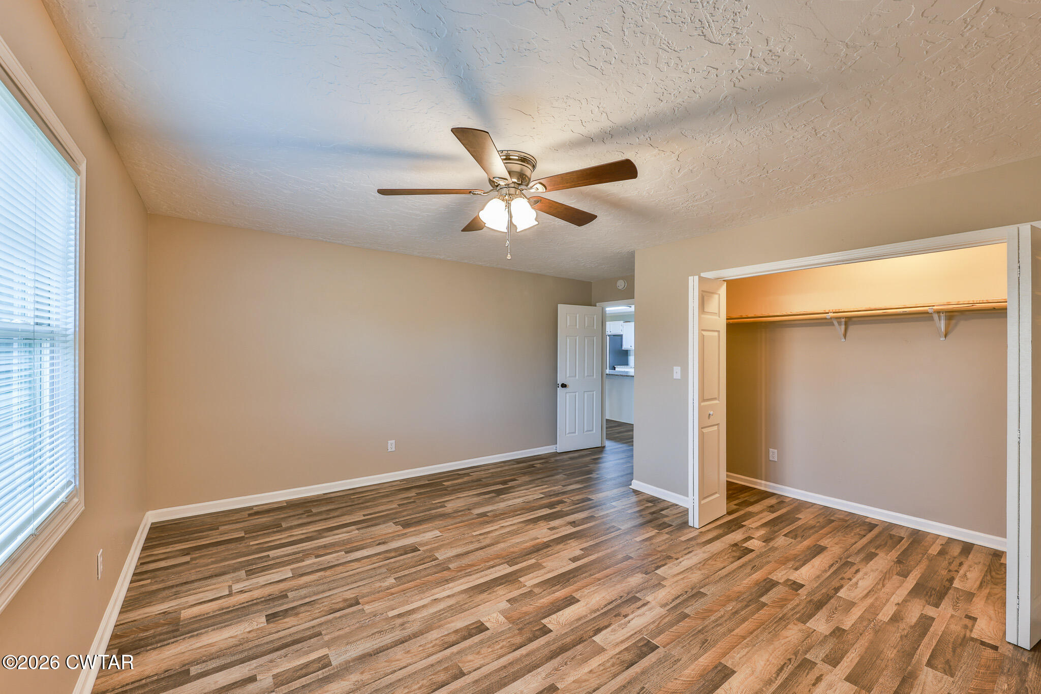 2479 Billingsby Road Martin, TN 38237 - Photo 19 of 29 a view of a room with wooden floor and a ceiling fan