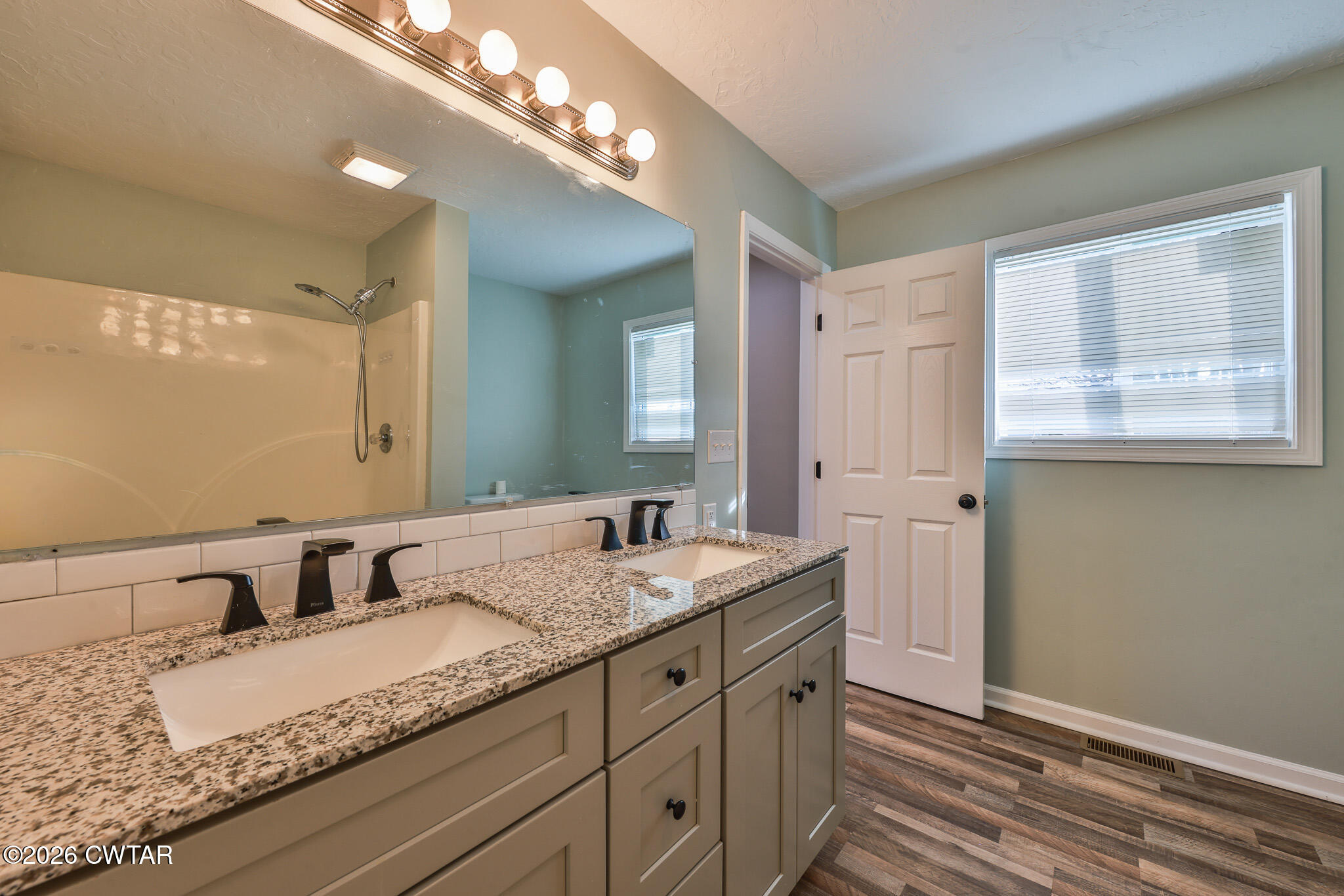 2479 Billingsby Road Martin, TN 38237 - Photo 20 of 29 a bathroom with a granite countertop sink and a mirror