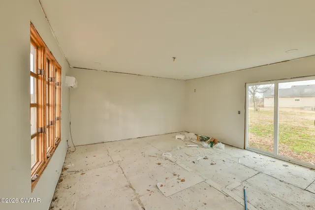 an aerial view of residential house with parking