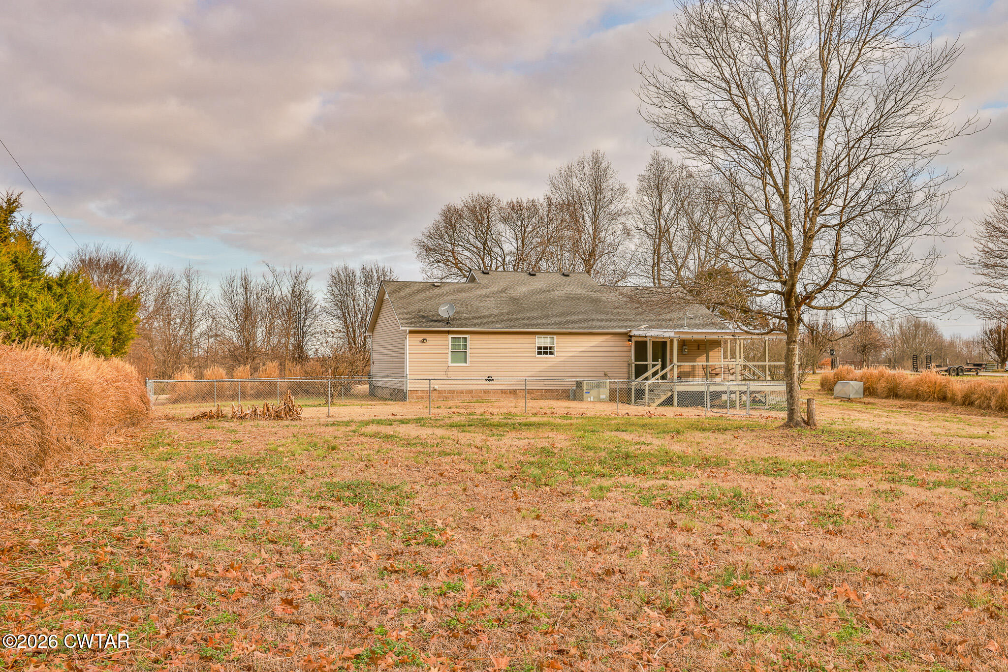 2479 Billingsby Road Martin, TN 38237 - Photo 6 of 29 a large house with a big yard and large trees