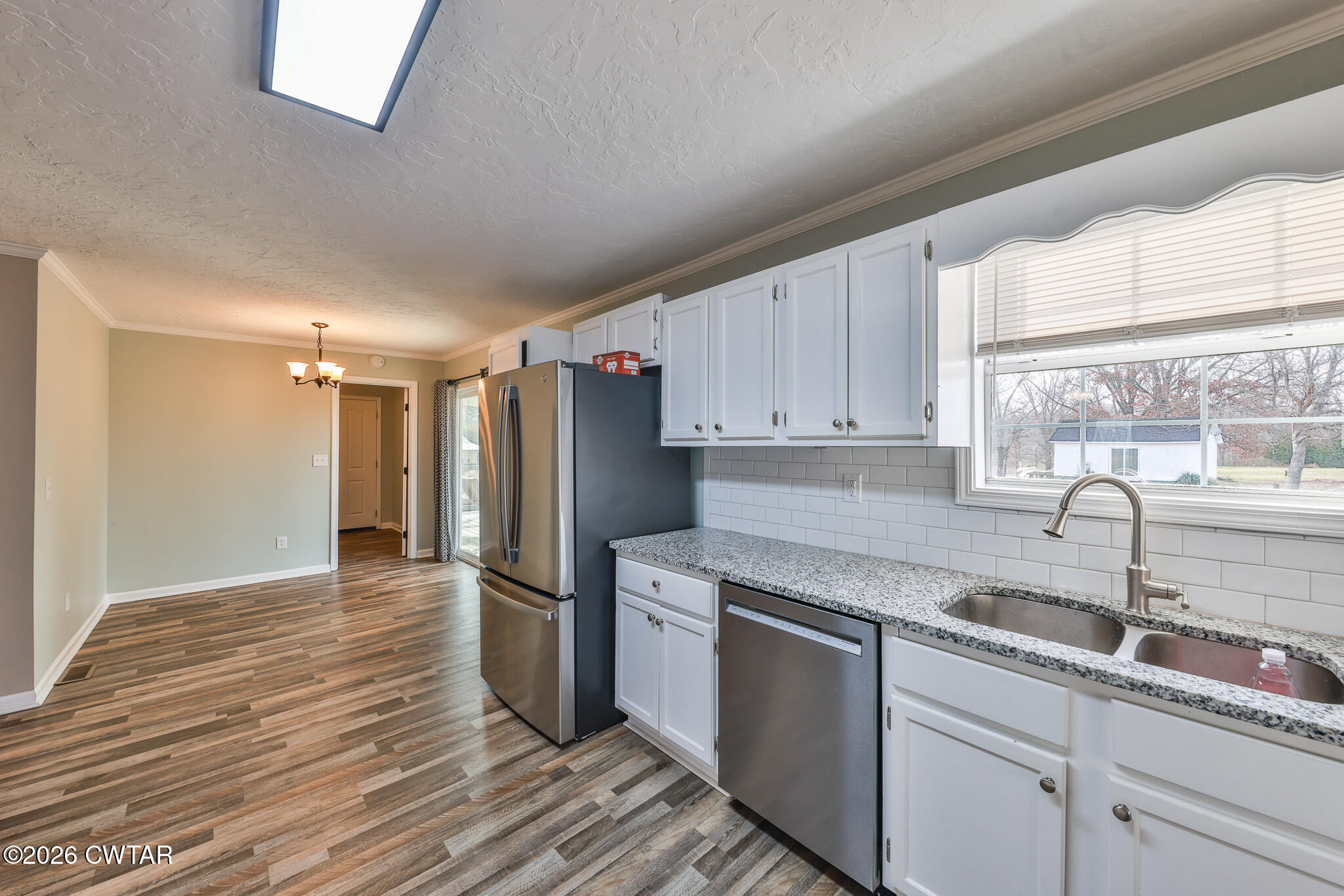 2479 Billingsby Road Martin, TN 38237 - Photo 8 of 29 a kitchen with a sink cabinets stainless steel appliances and a window