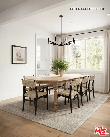 a dining room with furniture window and wooden floor