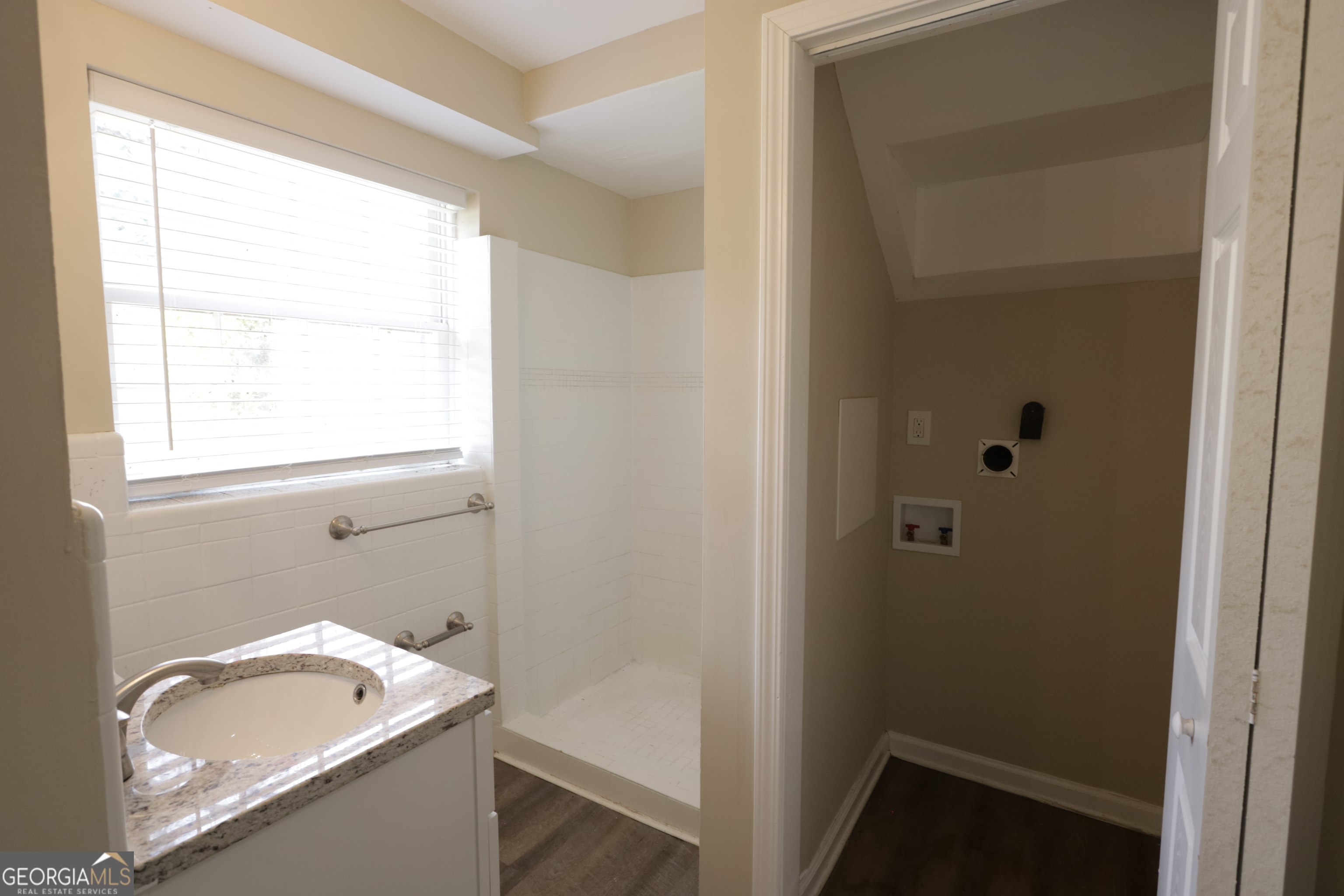 4326 Aldergate Drive Decatur, GA 30035 - Photo 11 of 11 a bathroom with a granite countertop sink toilet and window