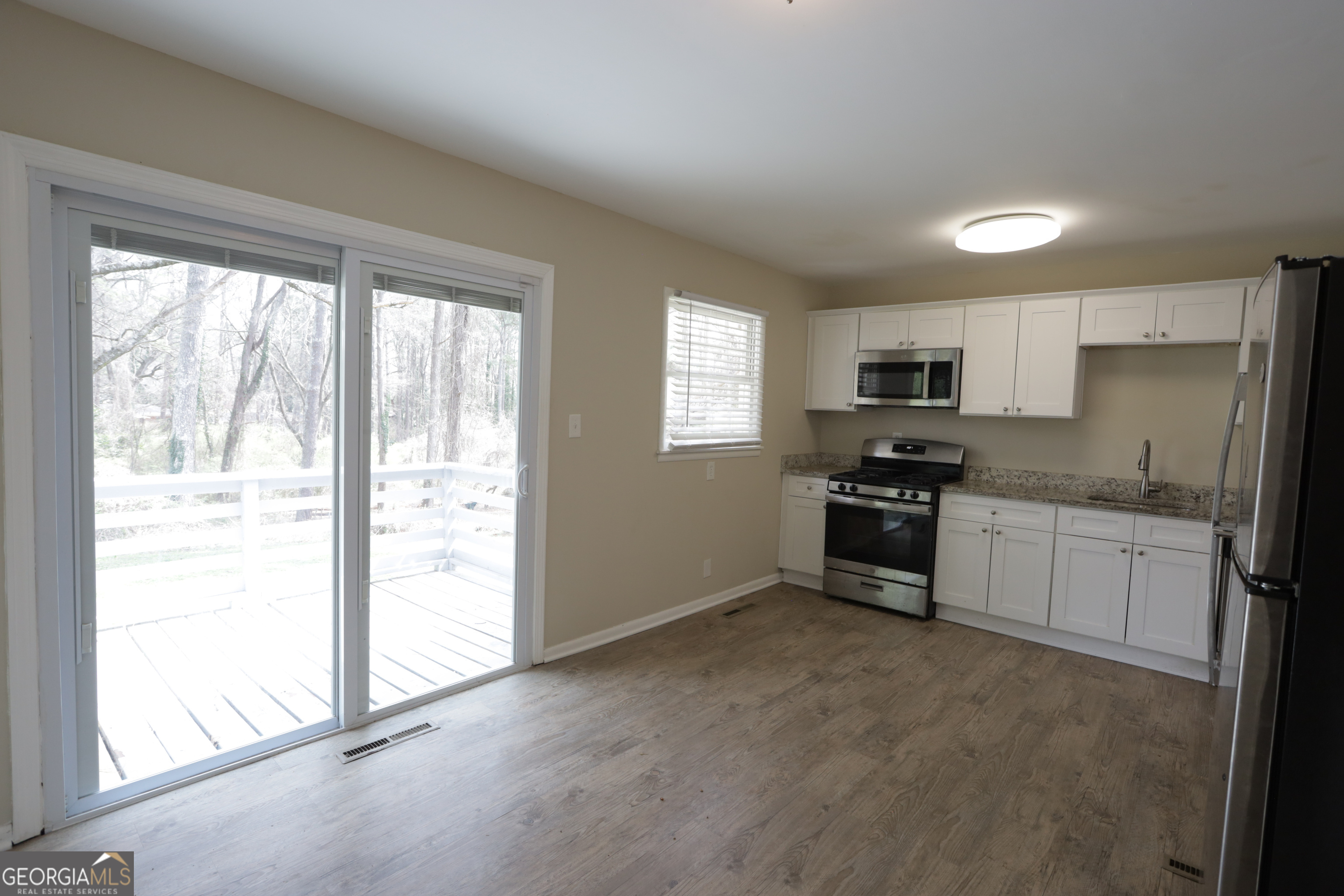 4326 Aldergate Drive Decatur, GA 30035 - Photo 5 of 11 a kitchen with stainless steel appliances a refrigerator and a stove top oven