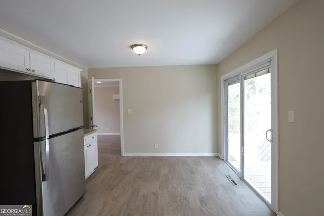 a view of a kitchen with a refrigerator a sink and a dishwasher