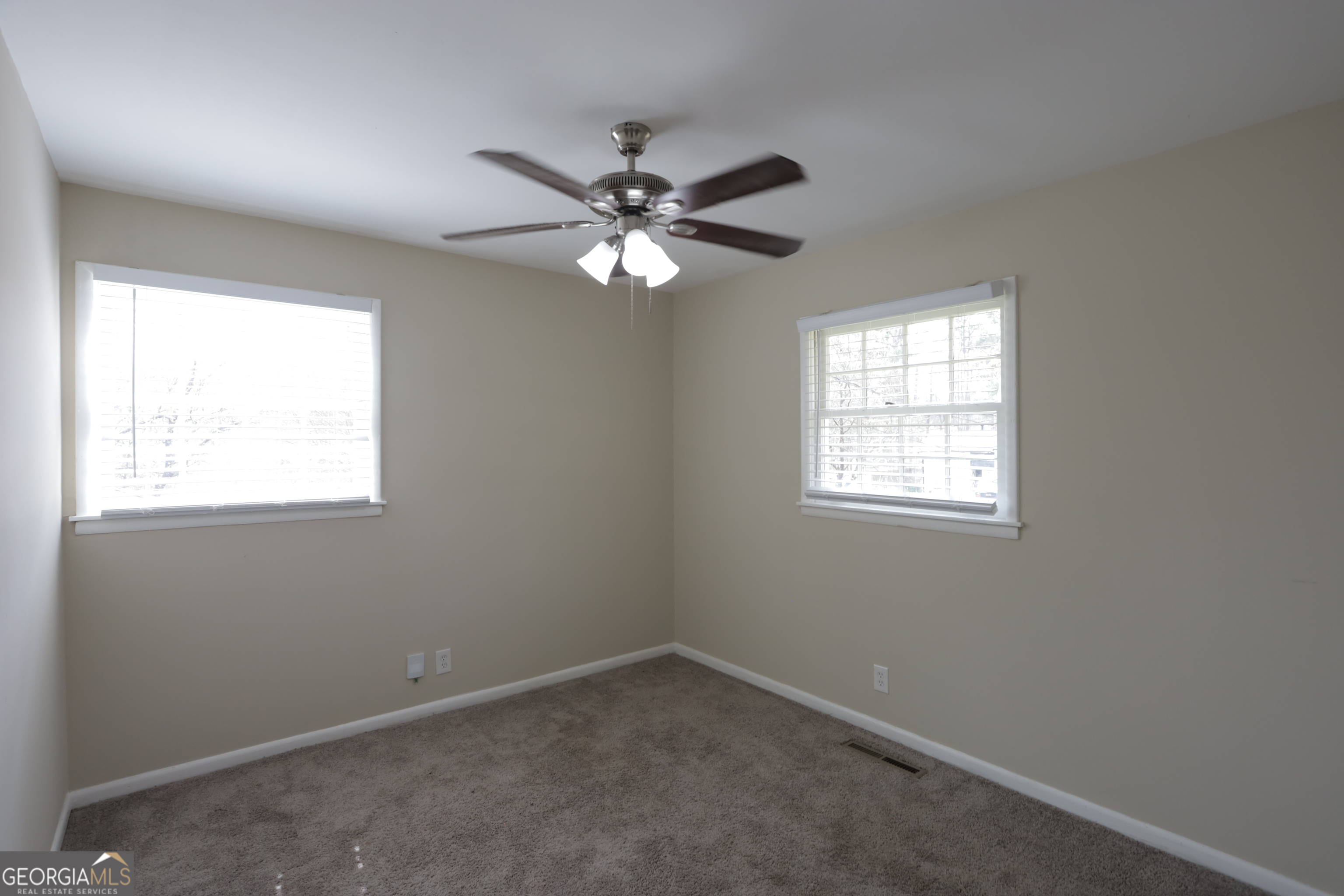 4326 Aldergate Drive Decatur, GA 30035 - Photo 8 of 11 an empty room with a window and a fan