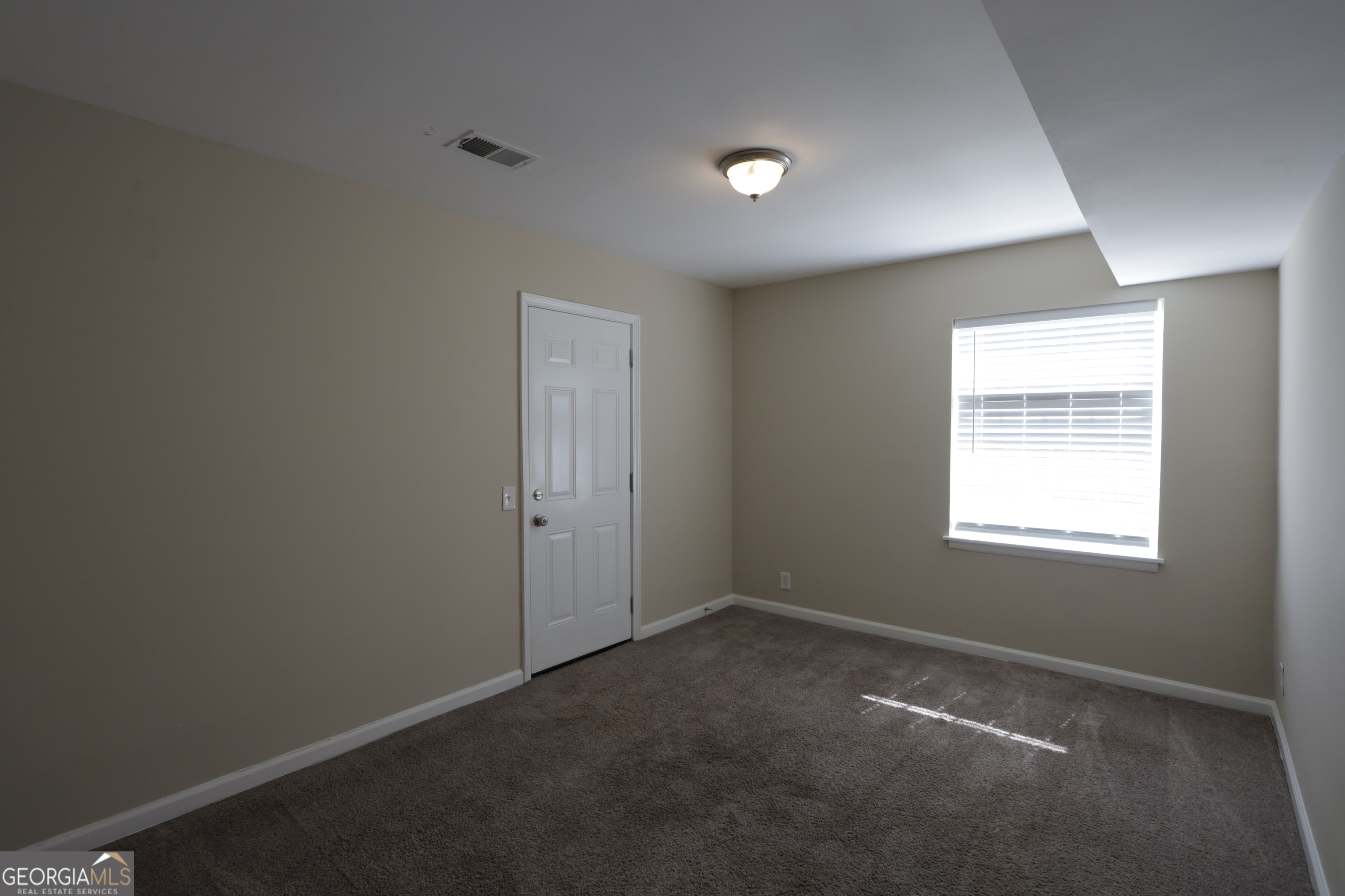 4326 Aldergate Drive Decatur, GA 30035 - Photo 10 of 11 an empty room with a empty space and a window
