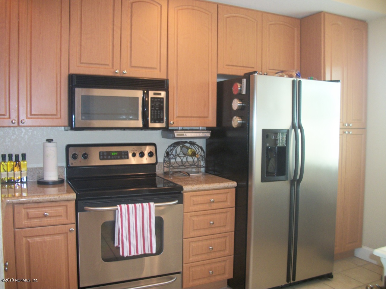 9745 Touchton Road, Unit 1823 Jacksonville, FL 32246 - Photo 3 of 21 a kitchen with stainless steel appliances granite countertop a refrigerator and a stove
