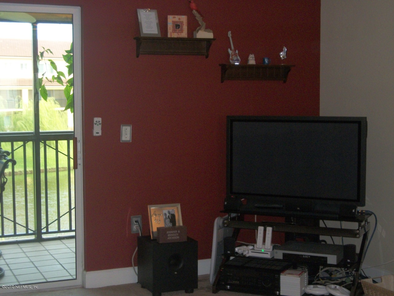 9745 Touchton Road, Unit 1823 Jacksonville, FL 32246 - Photo 8 of 21 a living room with furniture and a flat screen tv
