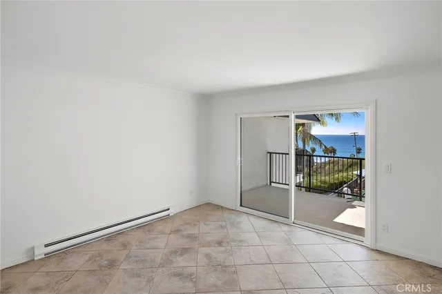 a view of an empty room and bathroom