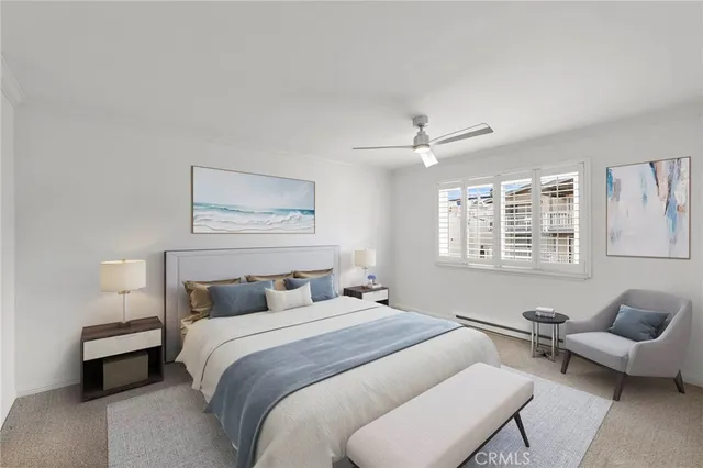 a bedroom with a bed and a couch