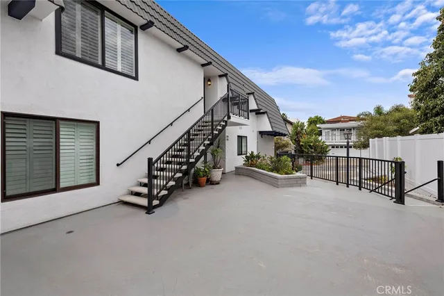 a view of a porch with furniture and a gate