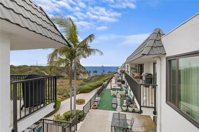 a view of balcony with furniture