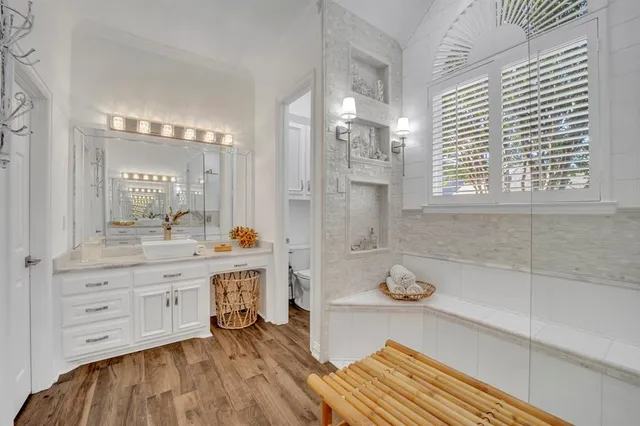 a bathroom with a double vanity sink and a mirror
