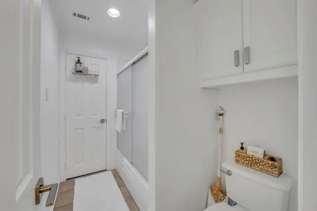 a bathroom with a sink toilet and vanity