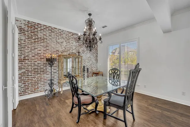 a view of a dining room with furniture and window