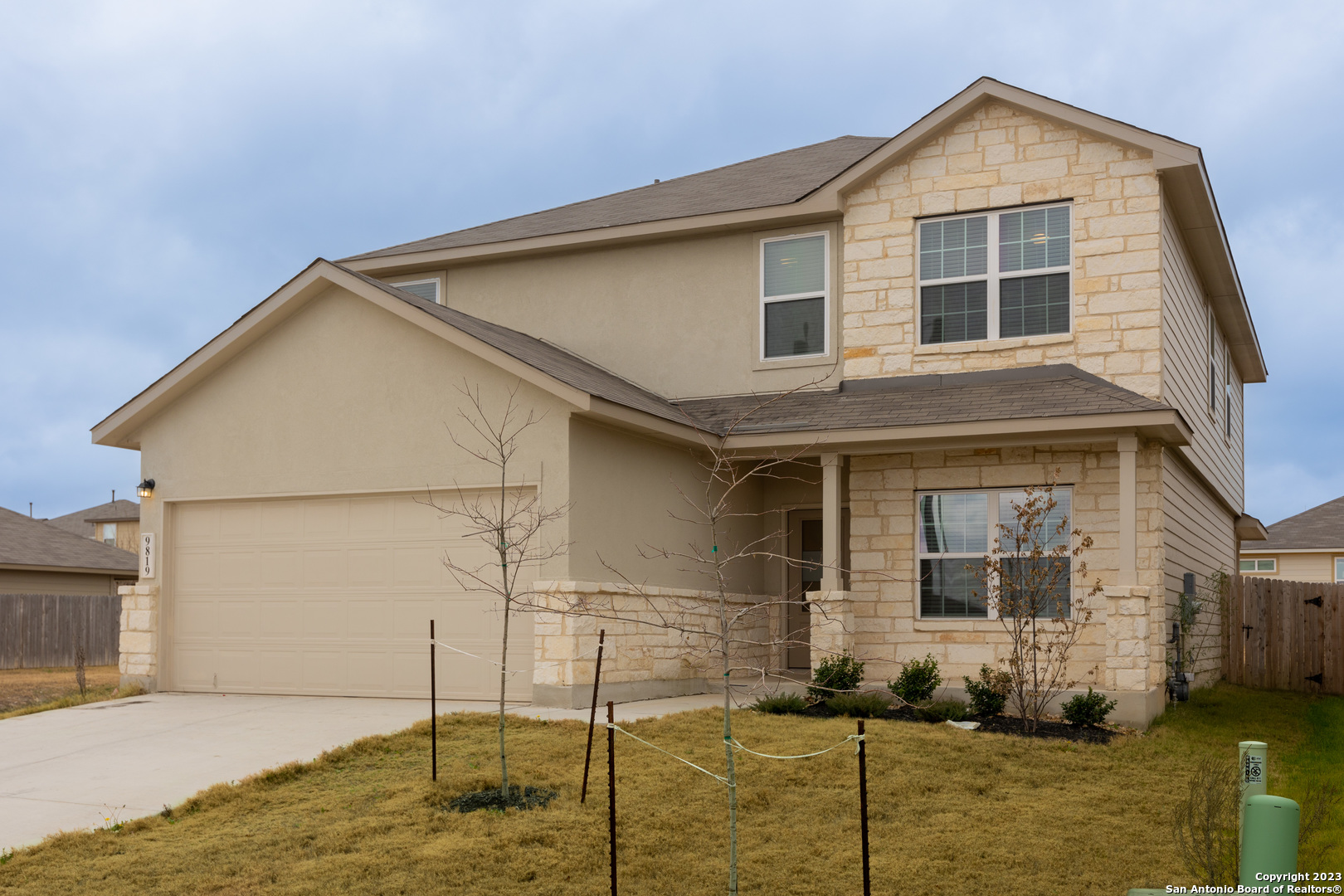 9819 Bratten Rise San Antonio, TX 78254 - Photo 2 of 37 a view of a house with a yard