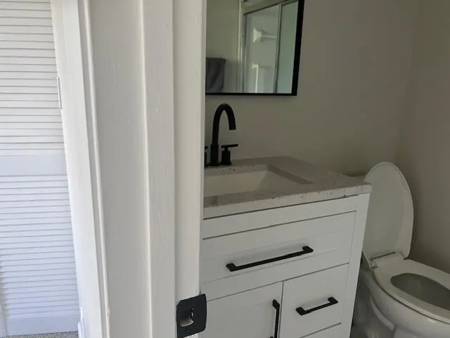a bathroom with a sink and toilet