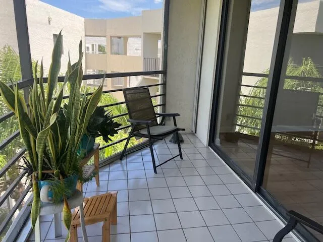 a view of a balcony with chairs