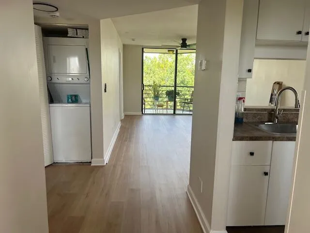 a view of hallway with wooden floor