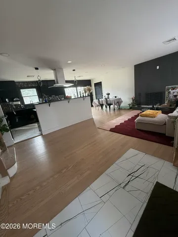 a view of a living room and kitchen