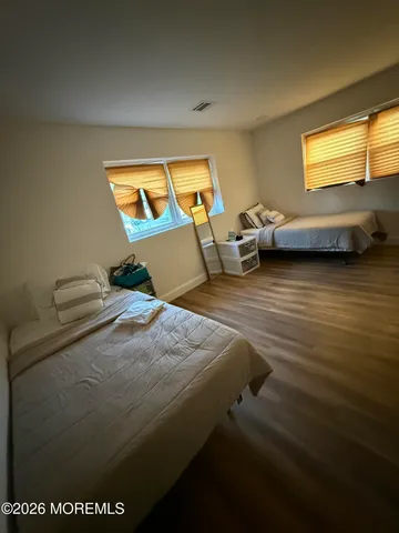 a bedroom with bed and window