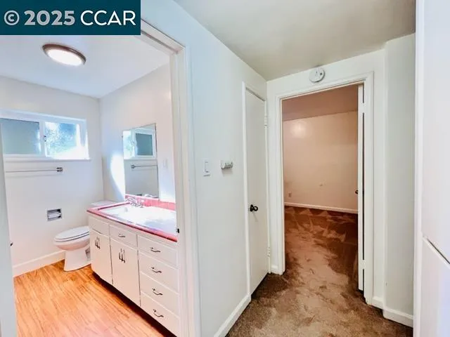 a en suite bathroom with a sink and mirror