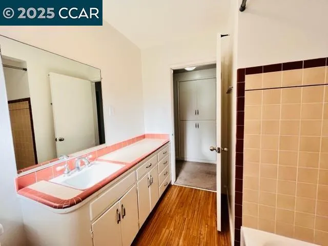 a view of hallway with wooden floor