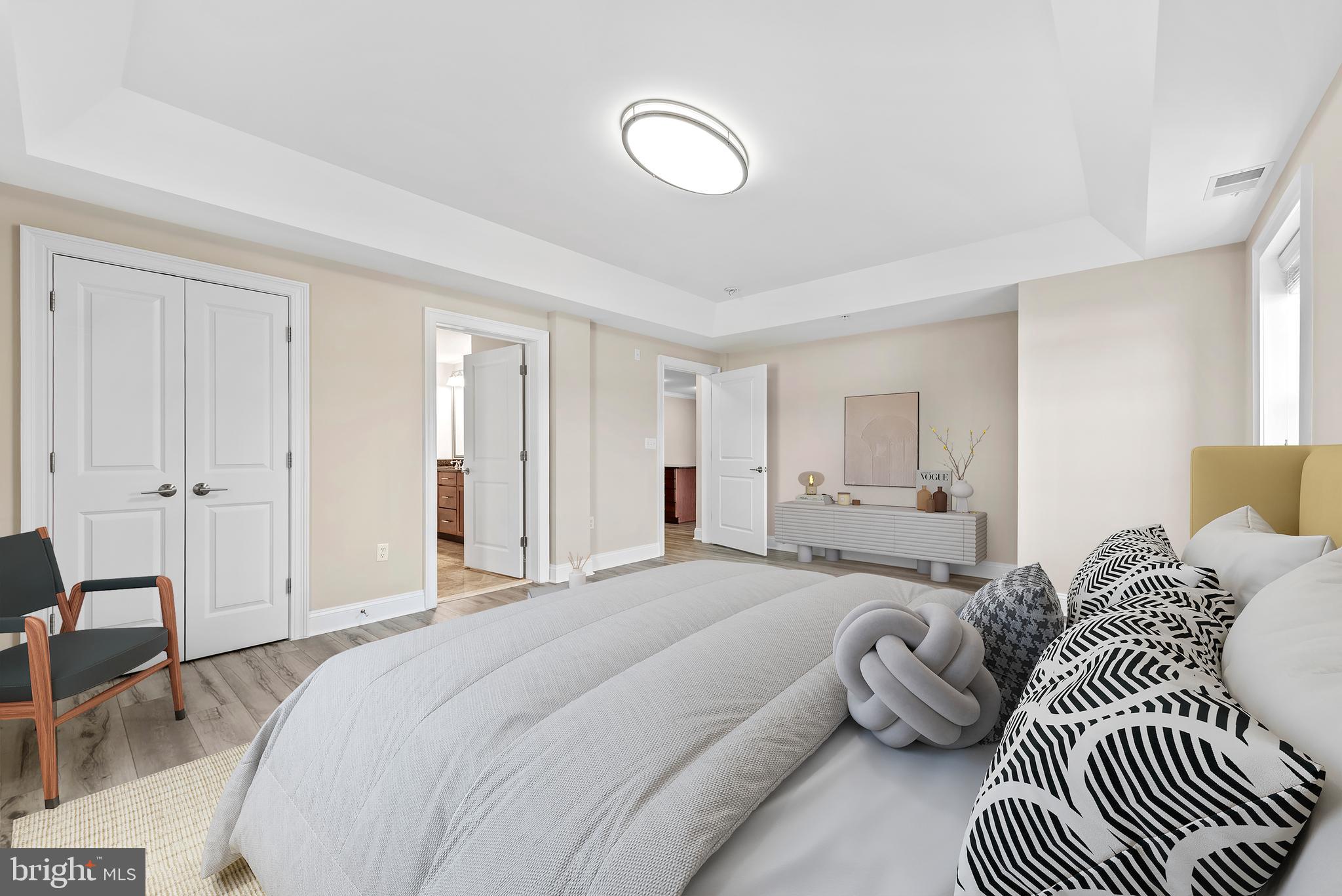 6301 Edsall Road, Unit 424 Alexandria, VA 22312 - Photo 19 of 30 a bedroom with a bed and a chandelier