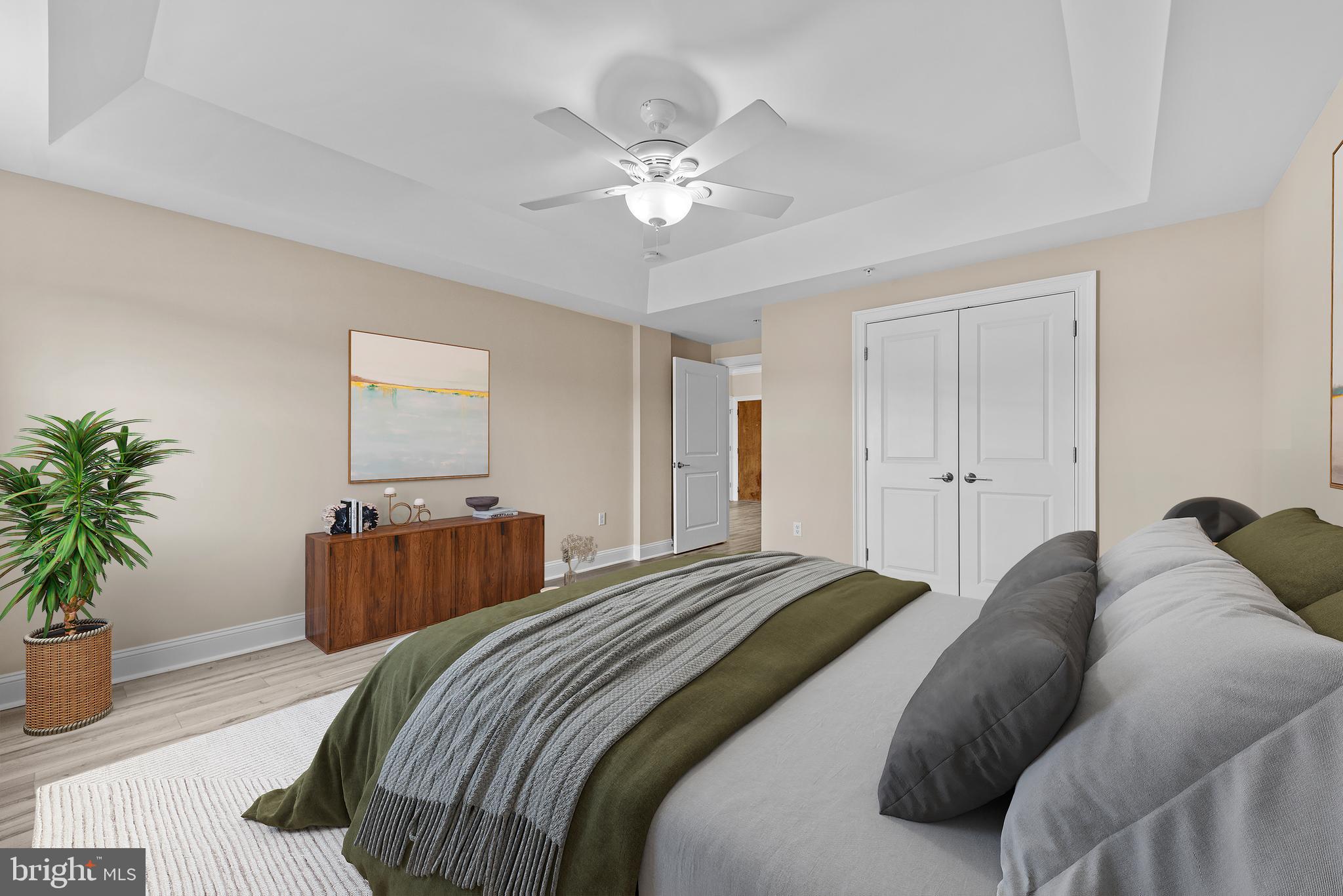 6301 Edsall Road, Unit 424 Alexandria, VA 22312 - Photo 24 of 30 a bedroom with bed and a chandelier