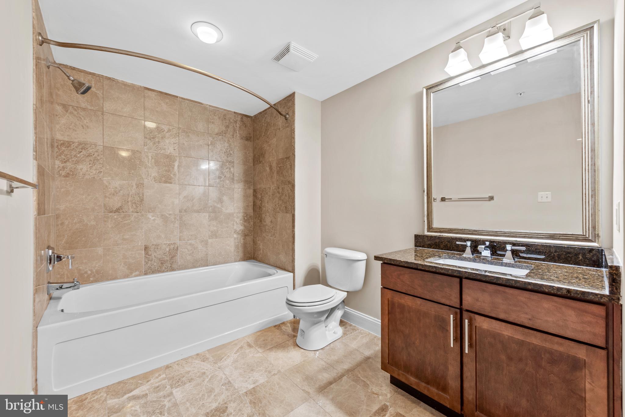 6301 Edsall Road, Unit 424 Alexandria, VA 22312 - Photo 26 of 30 a bathroom with a sink toilet and shower