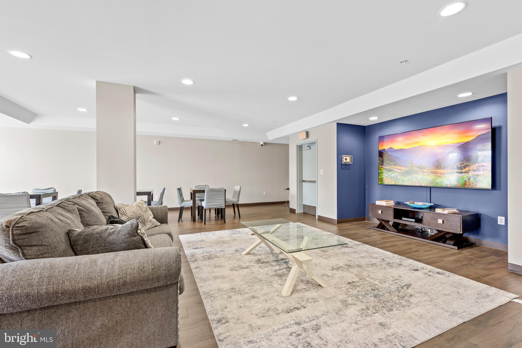 6301 Edsall Road, Unit 424 Alexandria, VA 22312 - Photo 27 of 30 a living room with furniture and a flat screen tv