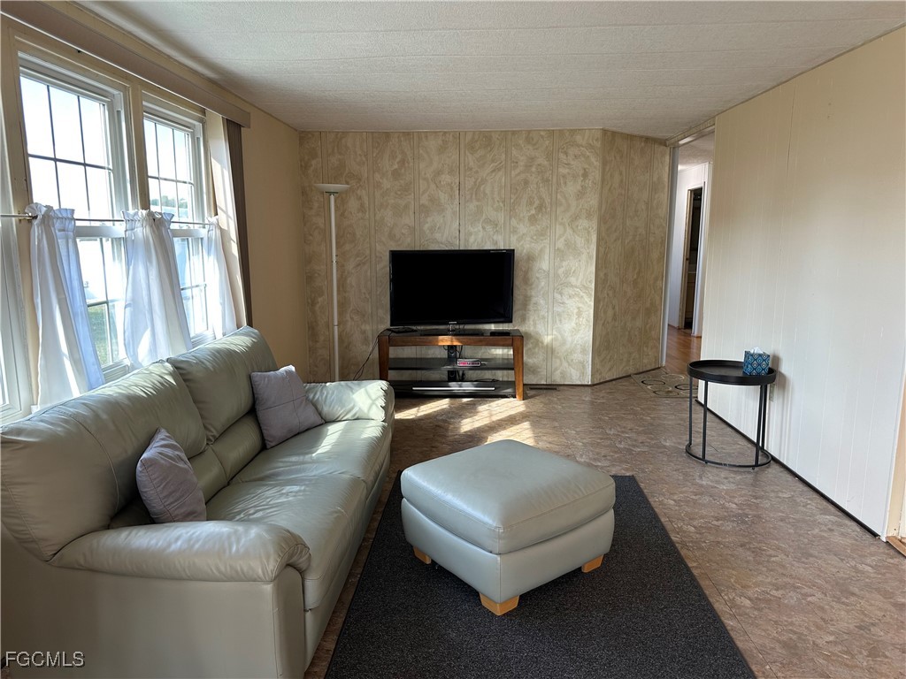 7 Elder Alva, FL 33920 - Photo 14 of 47 a living room with furniture and a flat screen tv