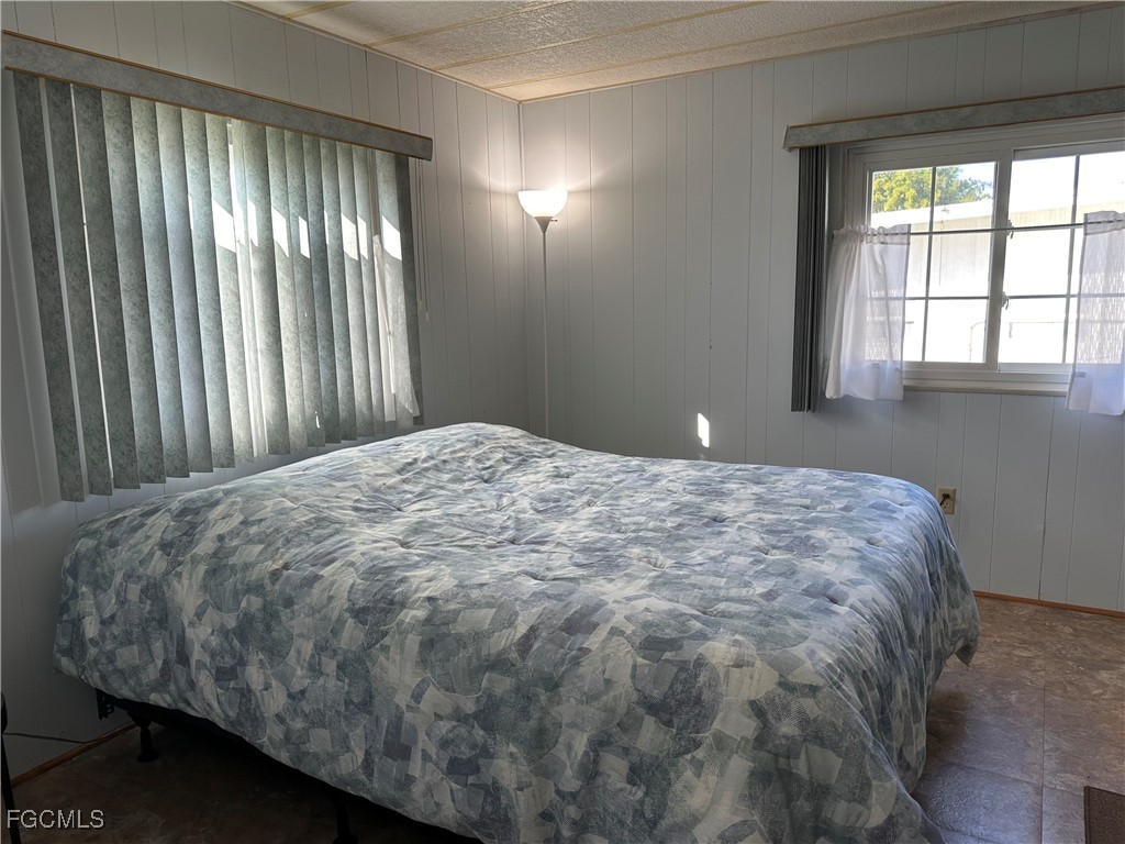 7 Elder Alva, FL 33920 - Photo 20 of 47 a bed sitting in a bedroom next to a window