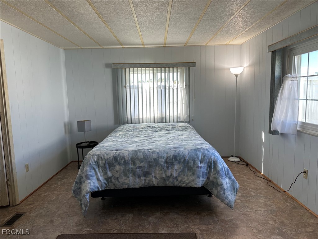 7 Elder Alva, FL 33920 - Photo 21 of 47 a bed sitting in a bedroom next to a window