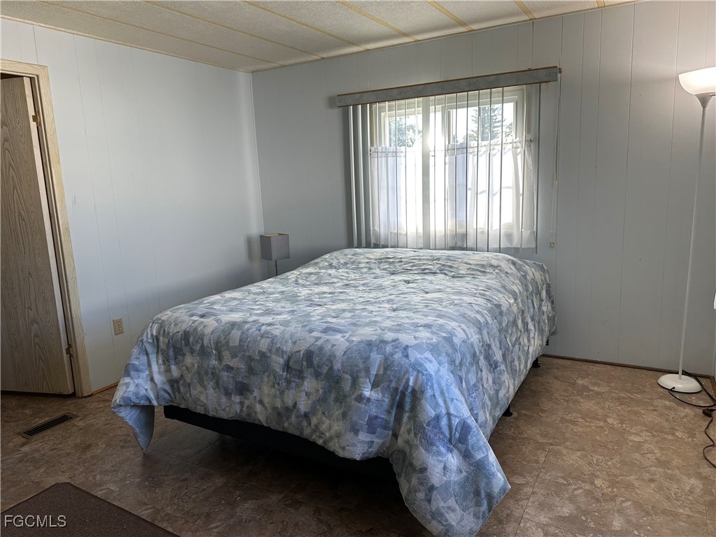 7 Elder Alva, FL 33920 - Photo 22 of 47 a bed sitting in a bedroom next to a window