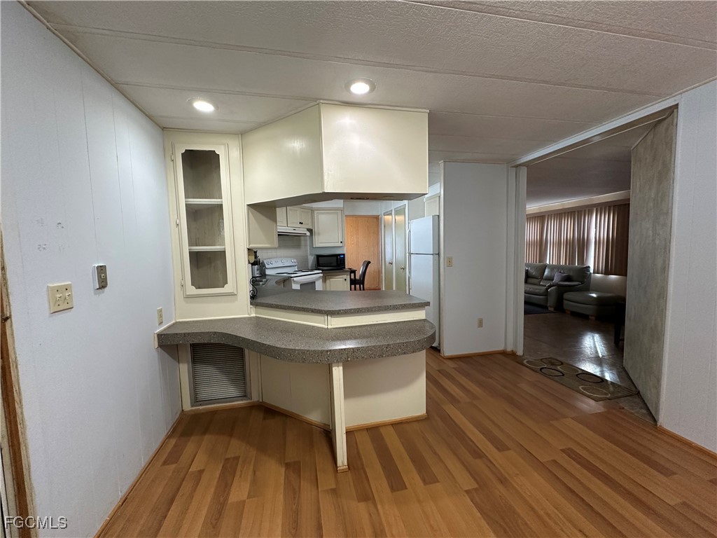 7 Elder Alva, FL 33920 - Photo 4 of 47 a view of living room with granite countertop furniture and wooden floor