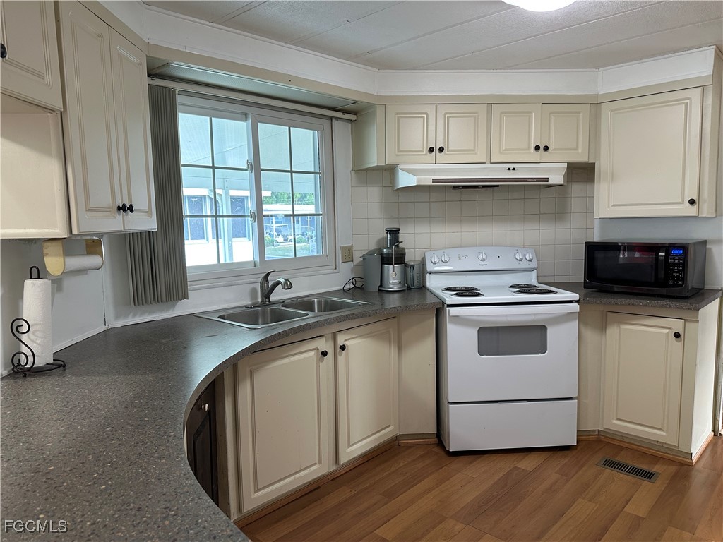 7 Elder Alva, FL 33920 - Photo 5 of 47 a kitchen with appliances cabinets and a sink