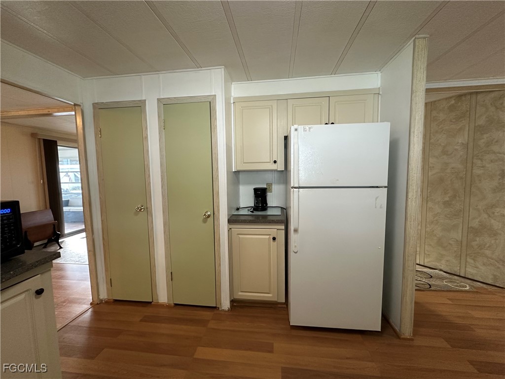 7 Elder Alva, FL 33920 - Photo 7 of 47 a white refrigerator freezer sitting in a kitchen