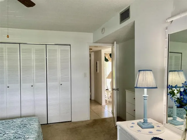 a view of a balcony with a table and chairs